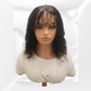 Mannequin head with a black wig on a white background