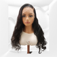 Mannequin head with long black body wave hair on a white background