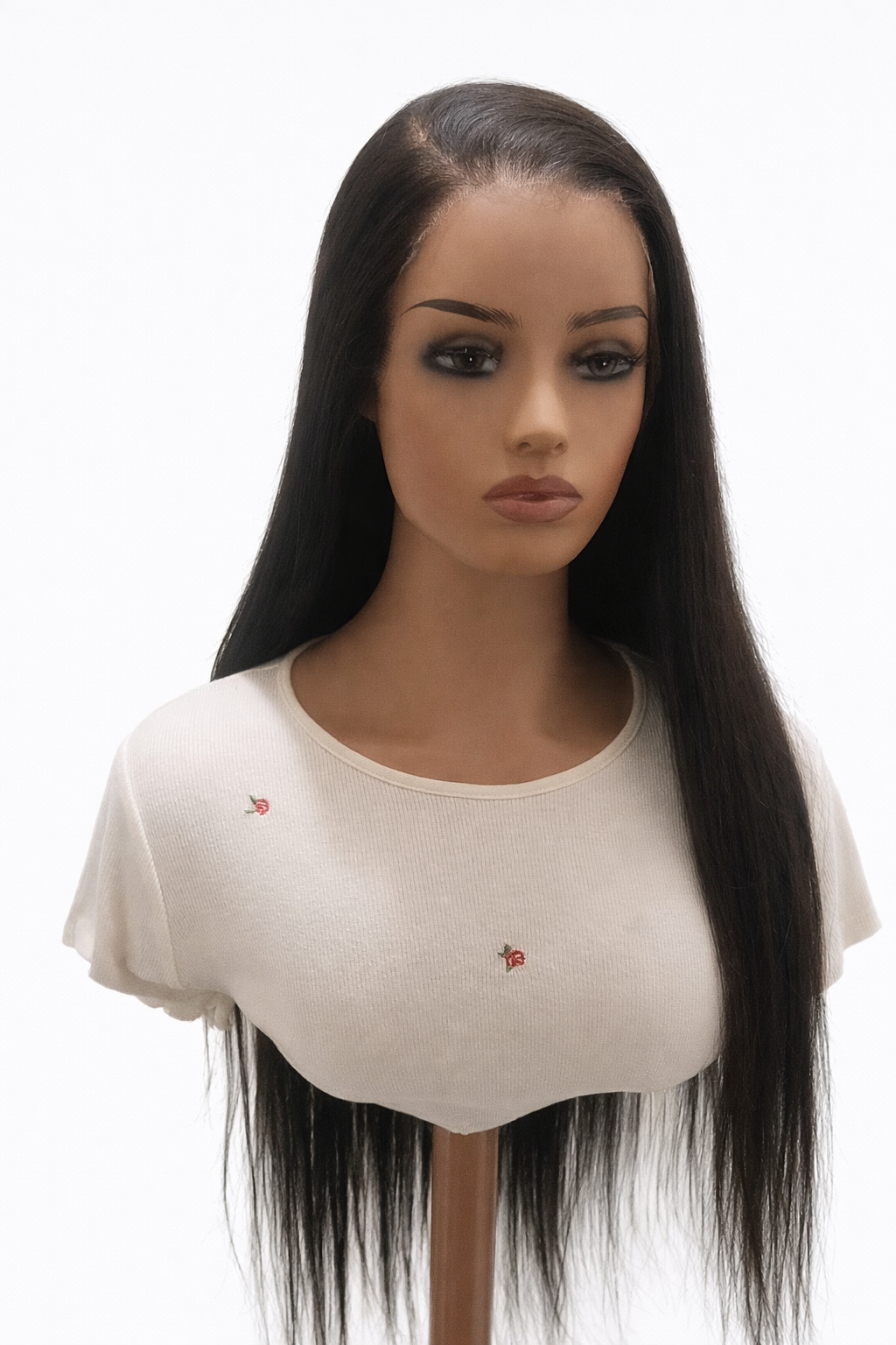 Mannequin head with long black hair on a white background