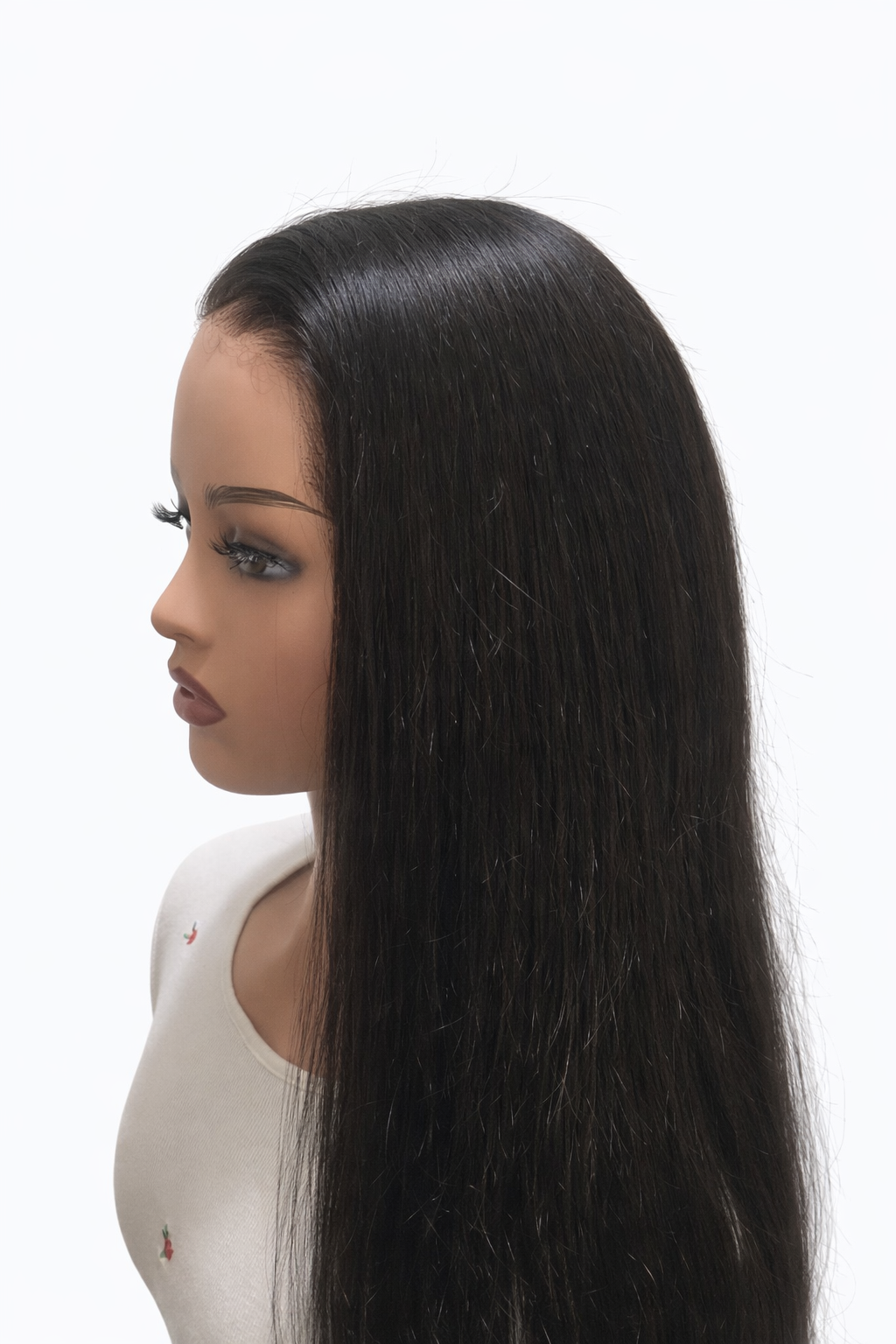Mannequin head with long black hair on a white background